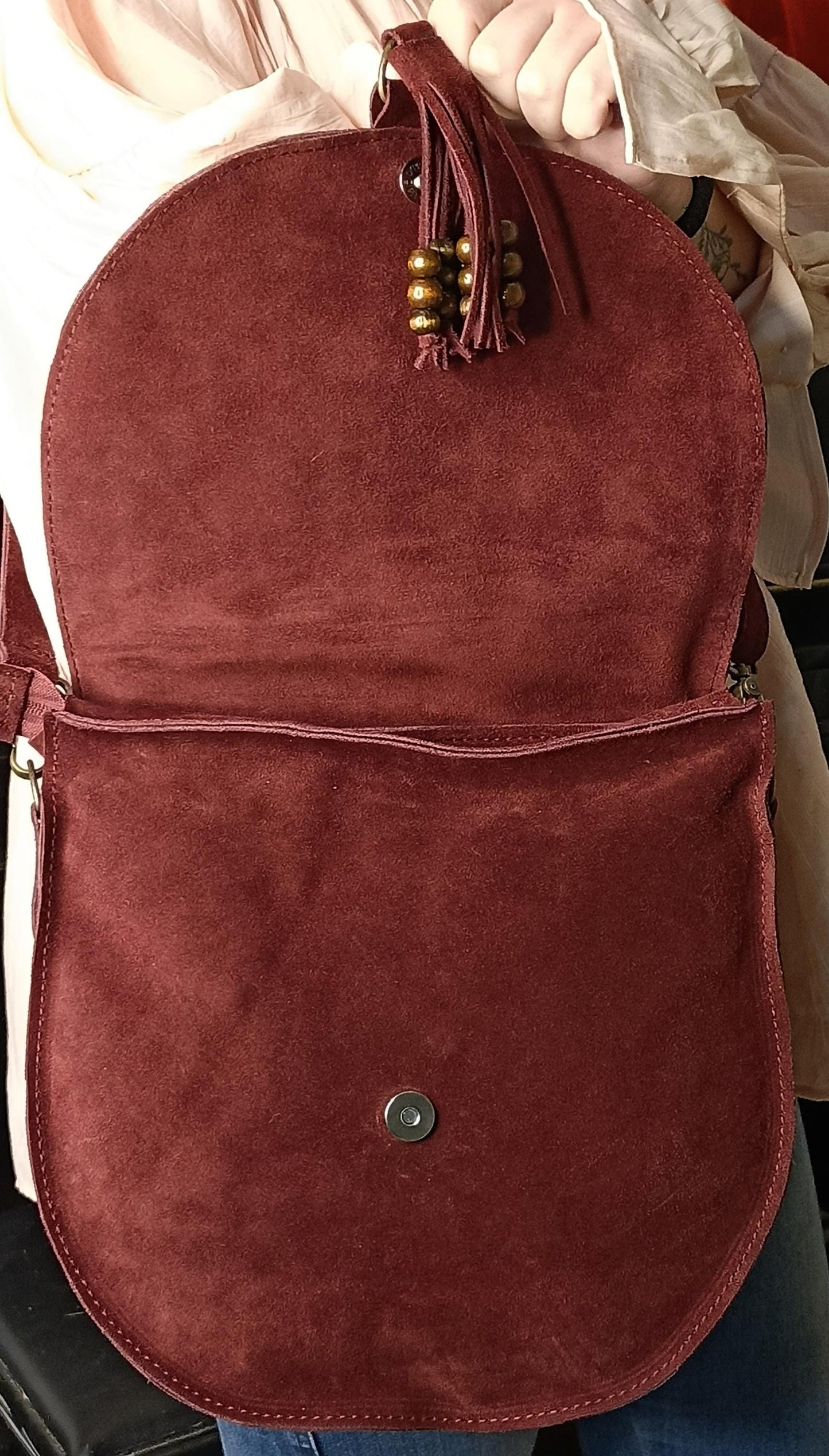 Made of real suede leather. It is a designer product.